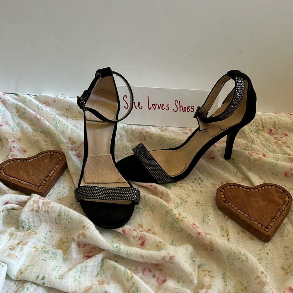 Special occasion black heel ankle strap pump.